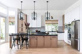 Chalk paint is the perfect choice for painting cabinets because it's simple to use and requires minimal prep. Kitchen Trend Wood Stained And Painted Cabinets Home Bunch Interior Design Ideas