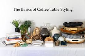 Scattered about in different shapes and sizes, candles can help break up a coffee table's sheer size. The Basics Of Coffee Table Styling Shades Of Blue Interiors