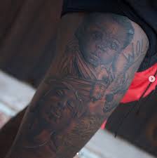 They passed a black sport utility vehicle (suv) sitting at a red light. Nba Tattoos John Wall