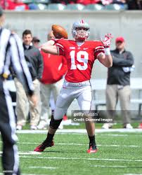 Running back Levi Ratliff of the Ohio State Buckeyes throws a pass... News  Photo