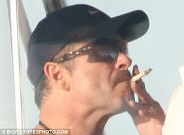 George Michael photographed smoking suspicious 'cigarette'