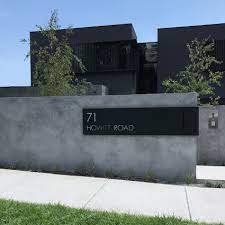 The modern look comprises of clean lines, earth colours, creative use of stone, and minimised use of divergent colours. Custom Letterboxes Sculptural Numbers Lump Sculpture Studio