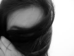 Woman with blonde hair covering her face. Nofacegirl Face