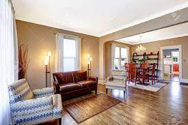 Stock Photo Living Room Interior With Hardwood Floor Leather Couch And Light Br Brown Living Room Decor White Lights Living Room Living Room Lighting Design