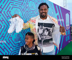 Cam Jordan, right, and son Caleb Tank arrive for the 2022 Pro Bowl