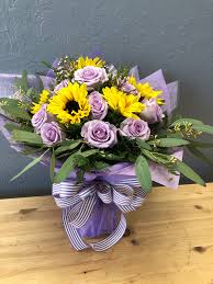 Approximate size of completed puzzle: Lavender Meets Sunflower Wrapped Bouquet By La Floriya