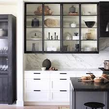 Modern european kitchen cabinets from mod cabinetry are an elegant and sophisticated design choice with an emphasis on maximizing clean lines. Black And White Kitchen With Glass Front Cabinets And Marble Backsplash Kitchen Interior Kitchen Design Glass Kitchen Cabinets