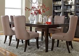 Wood construction with dark espresso finish; Saber Legs Dining Table With Solids Poplar Wood And Satin Espresso Finish