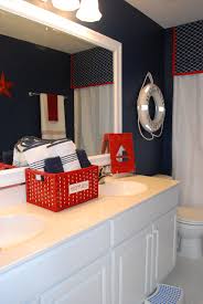 This small bathroom features a nautical theme using light blue paint for the sink wall and the tub base. Boys Bathroom With A Nautical Theme 11 Magnolia Lane Red Bathroom Decor Bathroom Red Red Bathroom Accessories