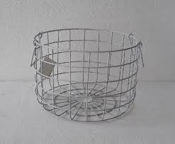 A wire basket sits in front of a black twin bed boasting a white headboard with black leather straps and placed between light oak nightstands lit by white lamps and. Round Wire Basket By K S International Round Wire Basket From Moradabad Id 4391488