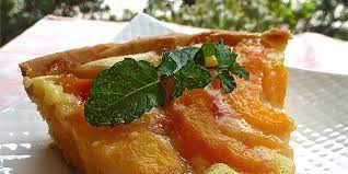 Cream cheese frosting and a garnish of grated carrot tops the cake. Dessert Recipes Allrecipes