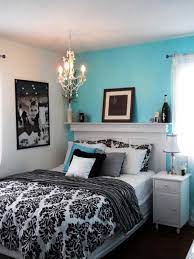 Blue weathered traditional style area rug layers on a bedroom wood floor accented a white wingback headboard with white bedding and blue striped pillows. Tween Bedrooms Pesquisa Do Google Tiffany Blue Bedroom Blue Bedroom Design Bedroom Colors