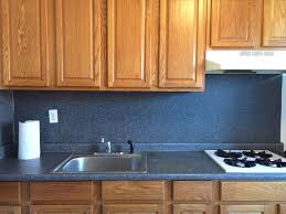 Cover the countertop with kraft paper or plastic sheeting, held in place by painter's tape, to prevent the tile adhesive from adhering to it. How To Cover Up This Blue Laminate Backsplash Hometalk