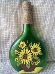 Acrylic Painting On Bottle The Bottle Is Painted With Acrylic Paint And The Jute Twine Around The Neck Of The Bo Bottle Painting Bottle Art Diy Bottle Crafts
