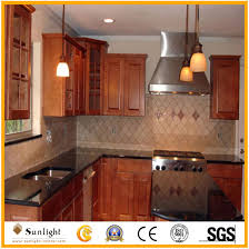 The kitchen features white cabinets, black countertops, black hardware, matte black faucet, black sink, countertop paint and peel and stick tile! China Natural Stone Black Galaxy Granite Kitchen Table Countertop China Granite Tile Granite Flooring