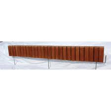 The tan color was chosen for its ability to blend into the scenery. Ecogreen 2 5 Ft Brown Flexible Wood Lawn Edging Eg430brn The Home Depot In 2021 Flexible Wood Lawn Edging Wood Playground