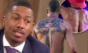 Nick cannon, host of america's got talent and husband to mariah carey is an american rapper, actor, comedian, director, screenwriter, film producer, entrepreneur, record producer, radio and television personality.there is no doubt that he is a tattoo freak and this clearly visible from his creative body inks. Nick Cannon Reveals How Painful It Was To Cover His Mariah Tattoo Daily Mail Online