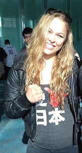 Her weight is 132 ibs in 61 in kg. Ronda Rousey Wikipedia