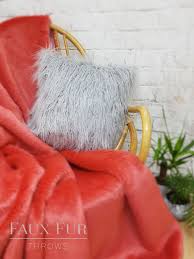 Faux fur throws give your room texture, style, and warmth. Coral Faux Fur Throw