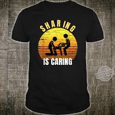 Sharing is caring means that if you share with that person, you actually care for the person. Sharing Is Caring Threesome Sex Polyamory Swingers Shirt