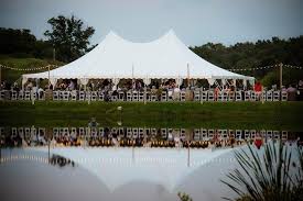 Outdoor Cafe Lighting Draped Over A 200 Long Dinner Table Lighting Support Poles Are Made Out Of W Outdoor Wedding Lighting Tent Wedding Ohio Wedding Venues