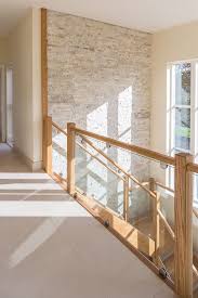Beautiful Hallway Stairs And Landing Cream Quartzite Splitface Tiled Feature Wall From Mandar Brick Feature Wall Stairs Feature Wall Feature Wall Living Room