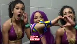 Bayley in a football showdown: Bayley And Sasha Banks Talk Wwe Roster Shake Up And Reveal Their Secret Handshakes