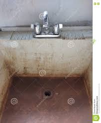 dirty slop sink with shiny polished