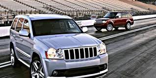 Cherokee Srt8 Vs Range Rover Sport These Powerful Brutes May Be Bad But Driving Them Is Oh So Good