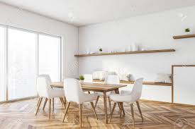 Beautiful dining room chairs especially for this price point i was extremely surprised!!!!! Corner Of Panoramic Dining Room With White Walls Wooden Floor Stock Photo Picture And Royalty Free Image Image 139211096