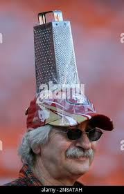 San Francisco 49ers fan John Boulos wears a cheese grater