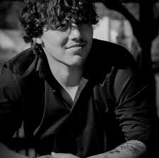 Who is the best tattoo artist for black and white tattoos with writing?