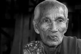 What are some tips for taking photos of yourself in low-light environments?