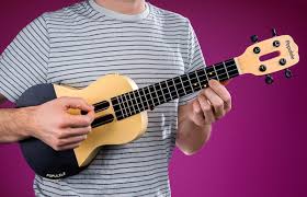 Sebring design build for more modern kitchen designs, choosing two contrasting tones can create a striking color scheme.this kitchen features bright white cabinets with a dramatic charcoal grey stacked stone backsplash. Populele Smart Ukulele That Teaches You How To Play