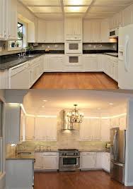 Kitchen renovated by Sage Construction in Tn (James Maciuk). Removed drop  down ceiling, added trim with lighting above the cabinets, removed double  ovens as focal point and replaced with range/ gas stove,
