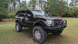 Nissan Pathfinder Titan Swap with 37s and Locked Rear Solid Axle Build