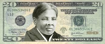 Twenty dollar bills with brown seal and serial numbers; Harriet Tubman Wins Survey For First Woman On The 20 Bill Bloomberg