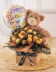 An Edible Arrangement Filled With Ferrero Rocher And Beyers Chocolate Stars The Perfect Gift To Say Ha Gift Bouquet Romantic Valentines Gift Chocolate Bouquet