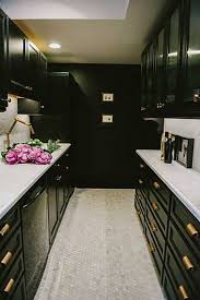13 Foolproof Ways To Do Black Cabinets Right Galley Kitchen Design Black Kitchen Cabinets Galley Kitchen Remodel