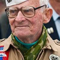 Dean Whitaker, former Prisoner of War, speaks to people