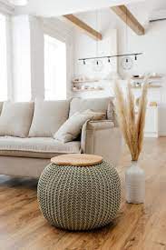 The large pouf equipped with concealed wooden structure and elastic suspensions is upholstered in brown leather (removable), allowing one to sit while sipping a cup of tea using the essential coffee table (5cm thick). Coffee Table Knitted Pouf By Chasha Home Seen At Private Residence Vienna Wescover