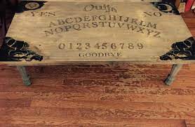 Share a cup of joe with a dearly departed loved one by sitting down by this ouija board coffee table. Handmade Ouija Board Coffee Table Diy Plans Spirit Talking Board Home Furniture Power Hand Tools Tools Home Improvement Bruno Cammareri Com