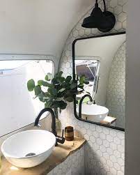 Airstream Bathroom Renovation Hex Tile Wall And Beautiful Faucet And Sink Bathroomrenovations Camper Bathroom Camper Decor Caravan Makeover