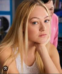 Guys I'm a terrible fan. On Next Class Maya is talking about all the people  around her who have died and she's like “my band mate died form a texting  and driving