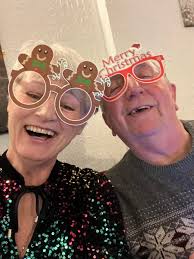 Moorhen feeding one of her three chicks near Bridge 47