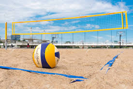 Rain, sunrays, heat, and sand. Beach Volleyball Ball On The Sand And Net On Background Stock Photo Picture And Royalty Free Image Image 151128754