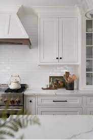 White and gray marbled countertop with a smooth finish for this traditional kitchen. 70 White Cabinets With White Countertop Going Out Of Style