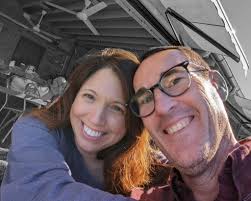 What gear should you leave your car in when parking downhill?