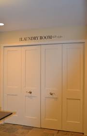 Clean And Crisp Bi Fold Doors With Trim Added To Make It Look Like A Craftsman Style Door My Washi Folding Closet Doors Laundry Doors Closet Door Makeover