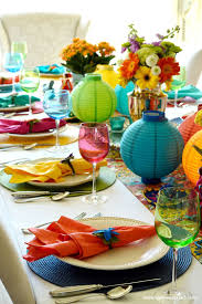Mexican party decorations pack, 1 papel picado banner, 1 table runner, 6 cocktail napkins and 1 set of centerpiece flags. Decorating The Table For A Cinco De Mayo Celebration Toot Sweet 4 Two Fiesta Table Mexican Table Setting Dinner Party Decorations
